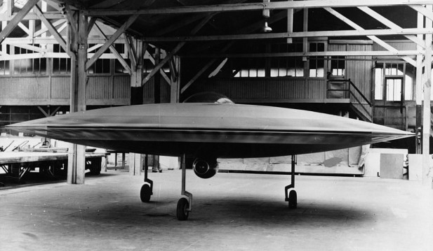 A 3/5 scale model of a proposed VTOL 'flying saucer' aircraft, the Couzinet Aerodyne RC-360, on display at a workshop on the Ile de la Jatte in Levallois-Perret, Paris, 1955.