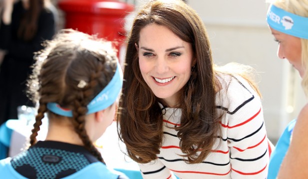 Catherine, Duchess of Cambridge speaks with runners from Team Heads Together ahead of the 2017 Virgin Money London Marathon, at Kensington Palace on April 19, 2017 in London, England.