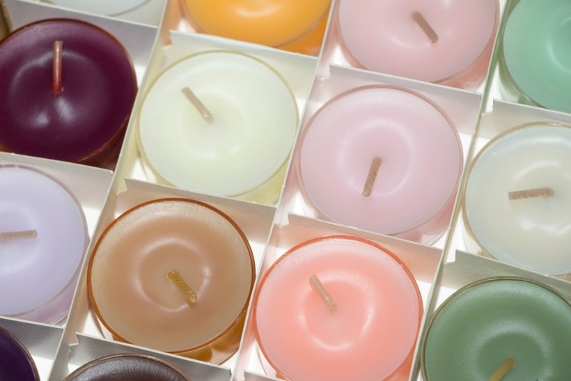 An assorted array of colored candles strategically placed around your room make an effective design element. 