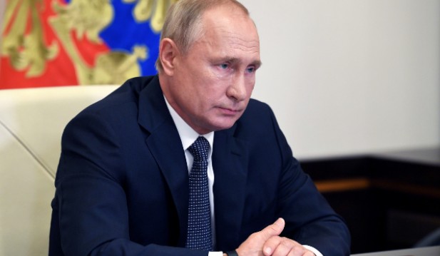 Russian President Putin chairs a meeting via video link outside Moscow