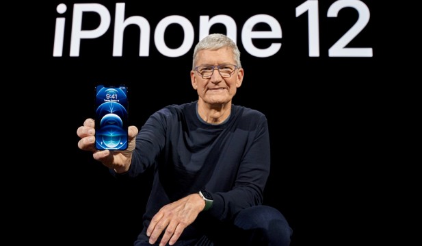 Apple CEO Tim Cook poses with the all-new iPhone 12 Pro at Apple Park in Cupertino