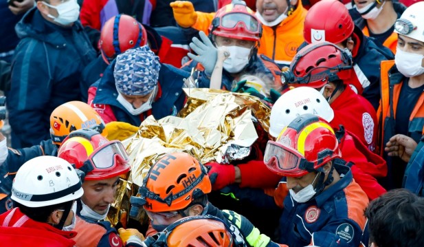 Rescue workers search for earthquake survivors in Izmir