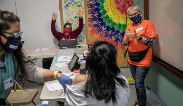 Immigrants Receive Covid-19 Vaccinations At Community Center Event
