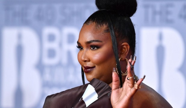 Watch: Lizzo Fakes Pregnant Belly After Fan Art Shows What Her and Chris Evans' Baby Would Look Like