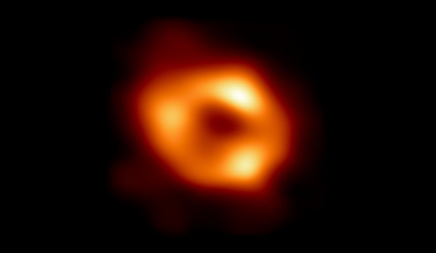 Cosmic Beam of Light Caused by Supermassive Black Hole Devouring Star 8.5 Billion Light-Years Away