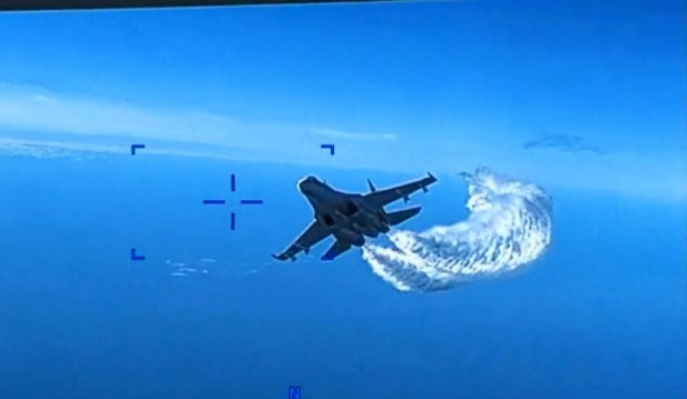 US Footage Shows Russian Fighter Plane Pouring Fuel On USAF Drone