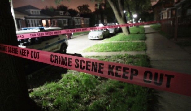 Crime scene tape in neighborhood