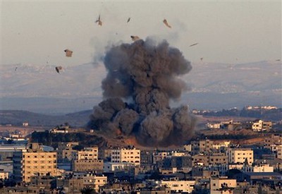 An explosion is seen after an Israeli strike in Beit Lahiya in the northern Gaza Strip, as seen from Gaza City, Saturday, Jan. 3, 2009.