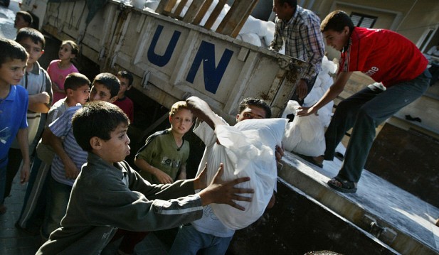 Palestinians receive food aid distribute