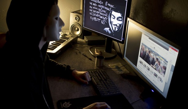 A masked hacker, part of the Anonymous g