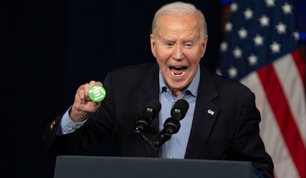 Joe Biden Holding Laken Riley Pin