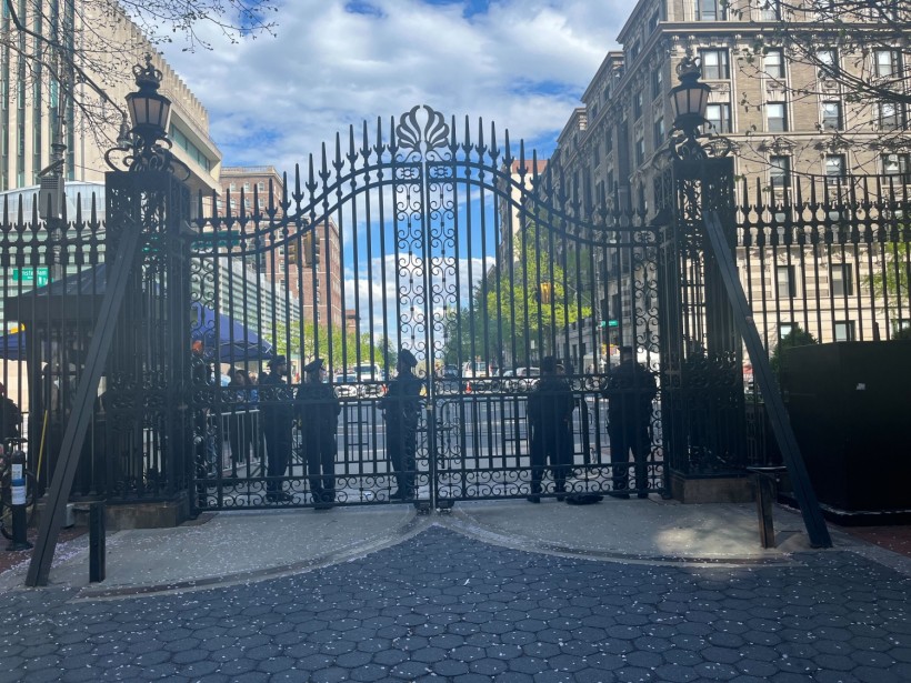 Police stand in front of the locked gates of Columbia University on April 24, 2024.