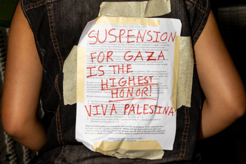  A protestor wears the university's disciplinary warning covered over by support for Palestinians in Gaza at Columbia University on April 29, 2024 in New York City. 
