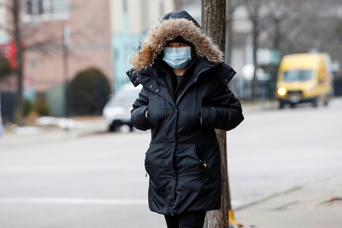 A woman wears a mask following the outbreak of the novel coronavirus, in Chicago