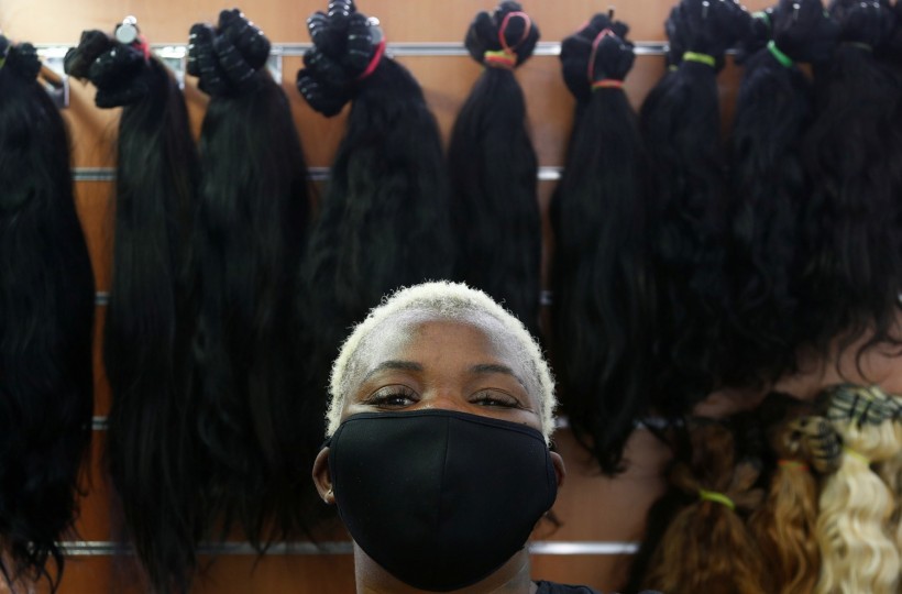 Hairdresser Nicky Chou poses in her hair salon at the Matonge gallery in Brussels