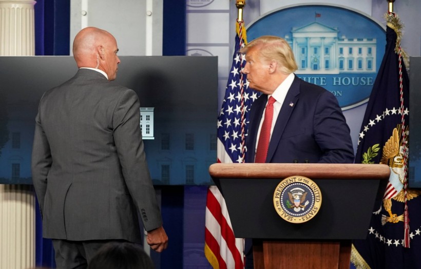 Trump escorted from the briefing room after a shooting outside the White House in Washington