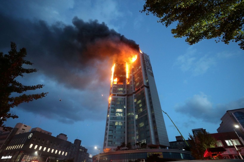A mixed-use high-rise residential building is engulfed by a fire in Ulsan