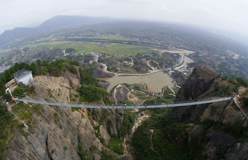 Glass Bridge in China Breaks During Gale-Force Winds, Leaving Tourist Clinging 330 Feet Above the Ground