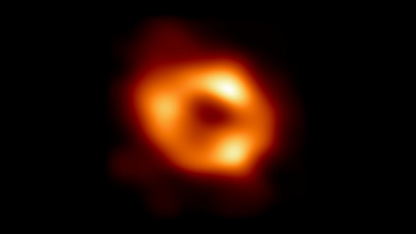 Cosmic Beam of Light Caused by Supermassive Black Hole Devouring Star 8.5 Billion Light-Years Away