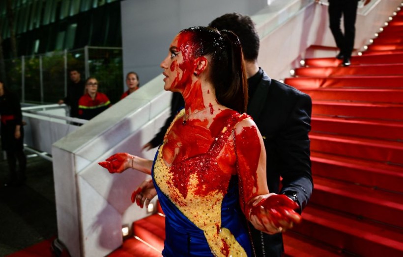 Cannes Film Festival: Woman Wearing  Ukrainian Flag Color Pours Herself 'Fake Blood'; Protests Outside Event Place Spark