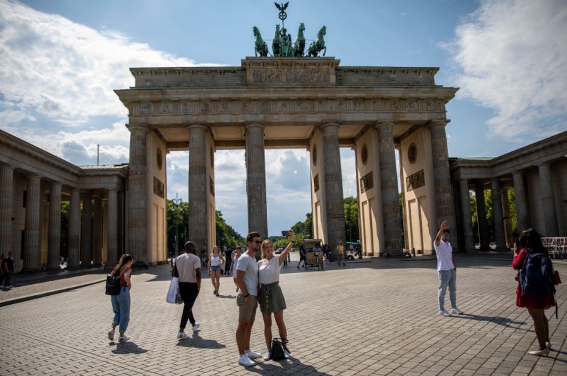 Germany's Brandenburg Gate Columns Spray Painted by Climate Activists Demanding End to Fossil Fuels